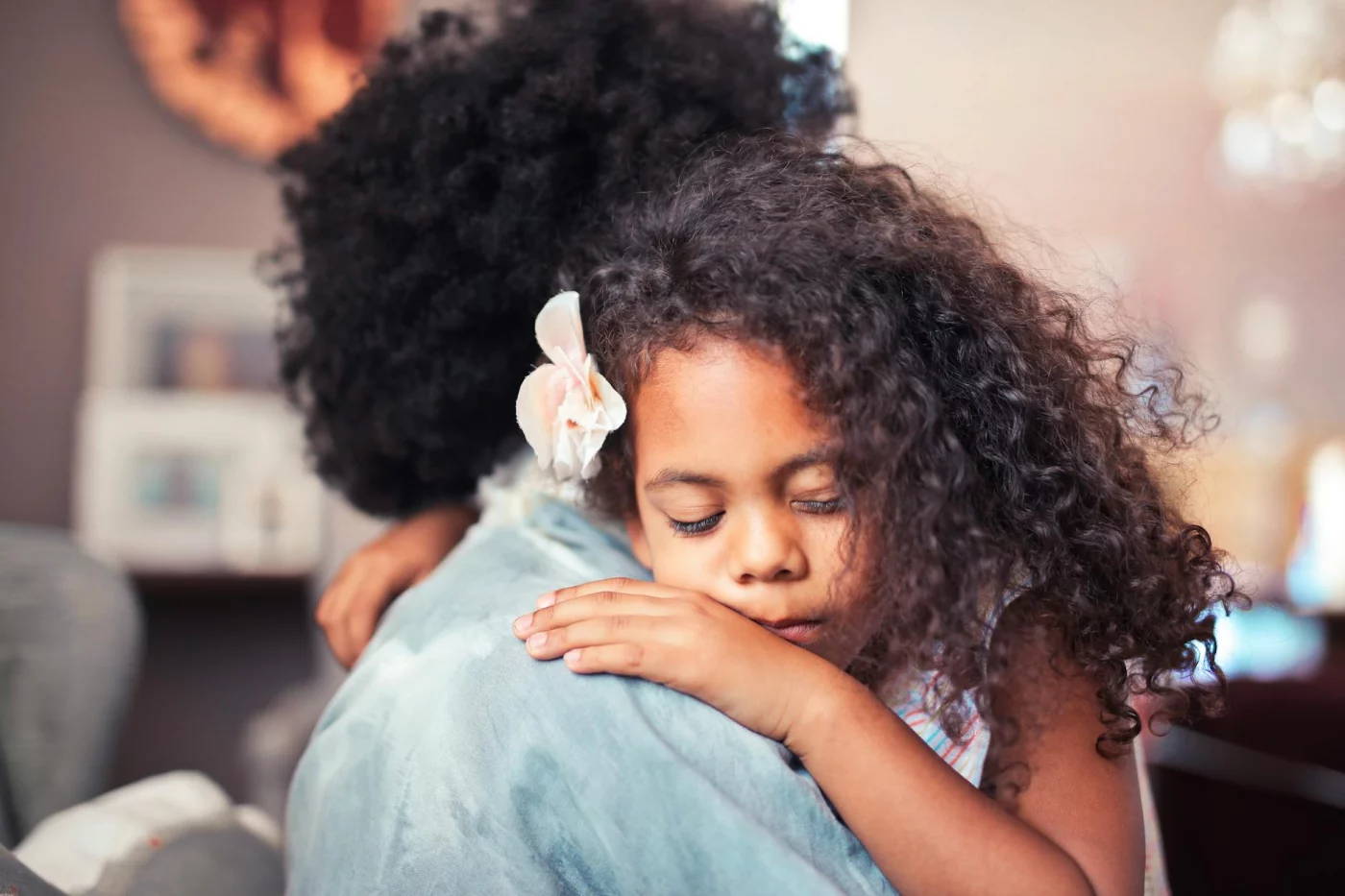 Mother and daughter hugging during an FAQ on how to be a single mom with no help and build stable routines
