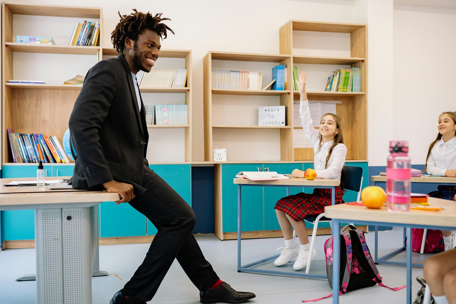 happy-relaxed-teacher-healthy-classroom-environment happy-relaxed-teacher-healthy-classroom-environment