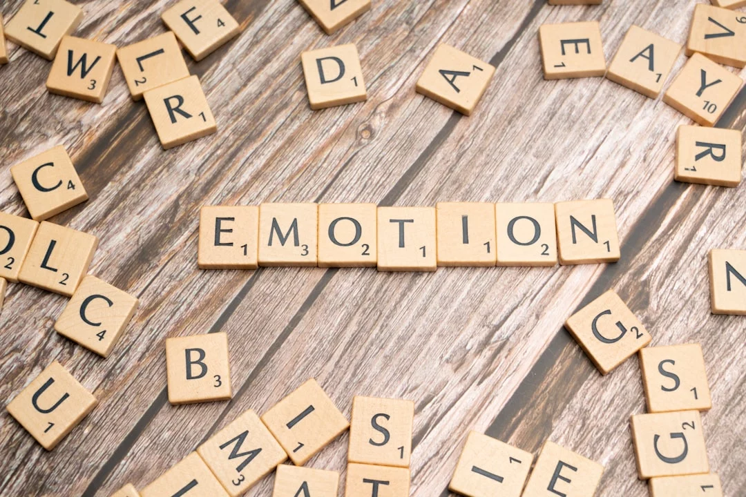 Scrabble tiles spelling emotion illustrate why is it important to develop emotional intelligence in daily life