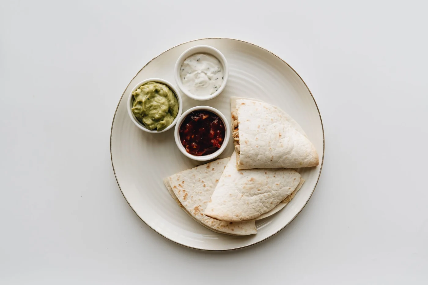 Simple quesadilla with guacamole, salsa, and sour cream, a flexible picky-eater meal