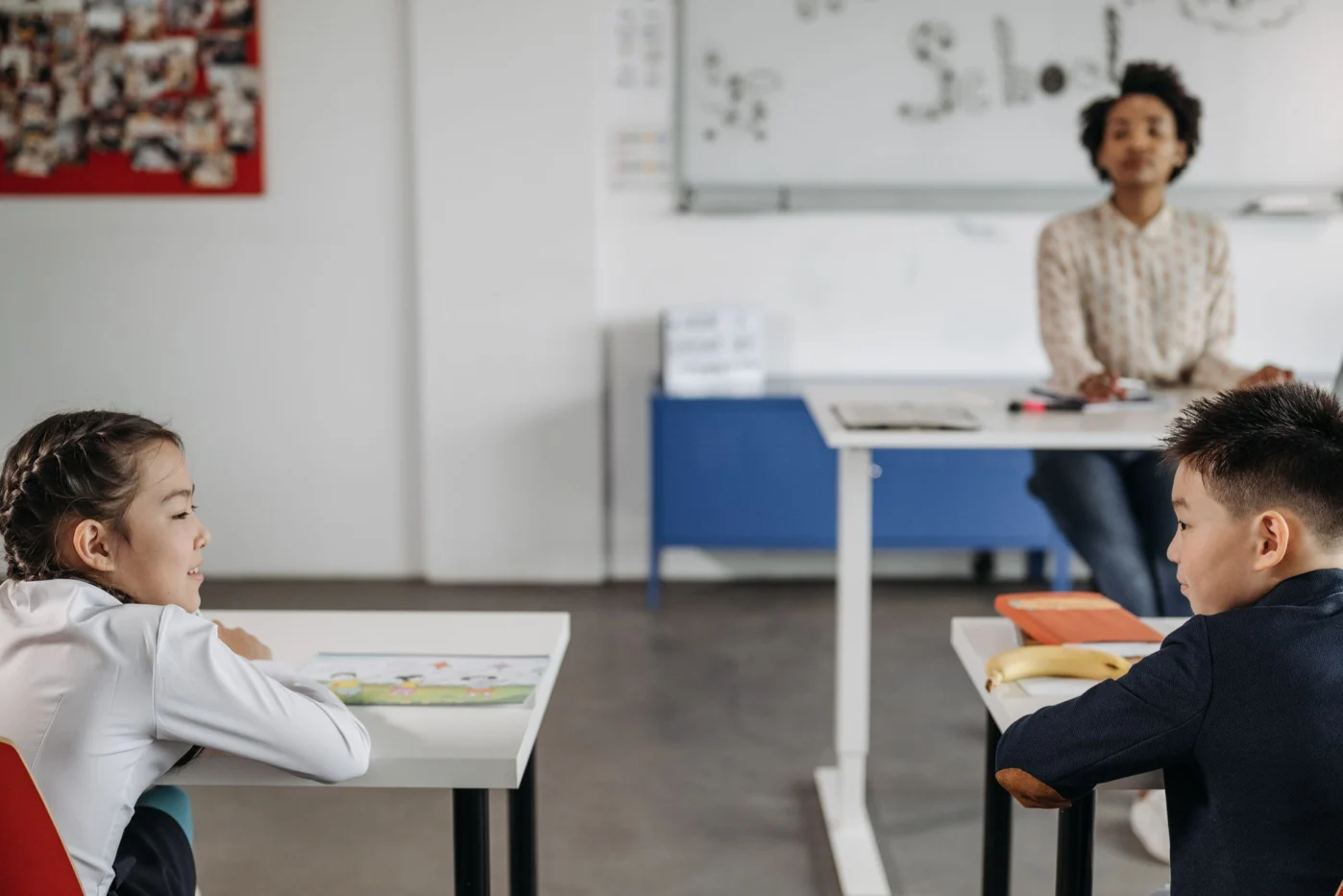Teacher supporting students during a calm classroom activity