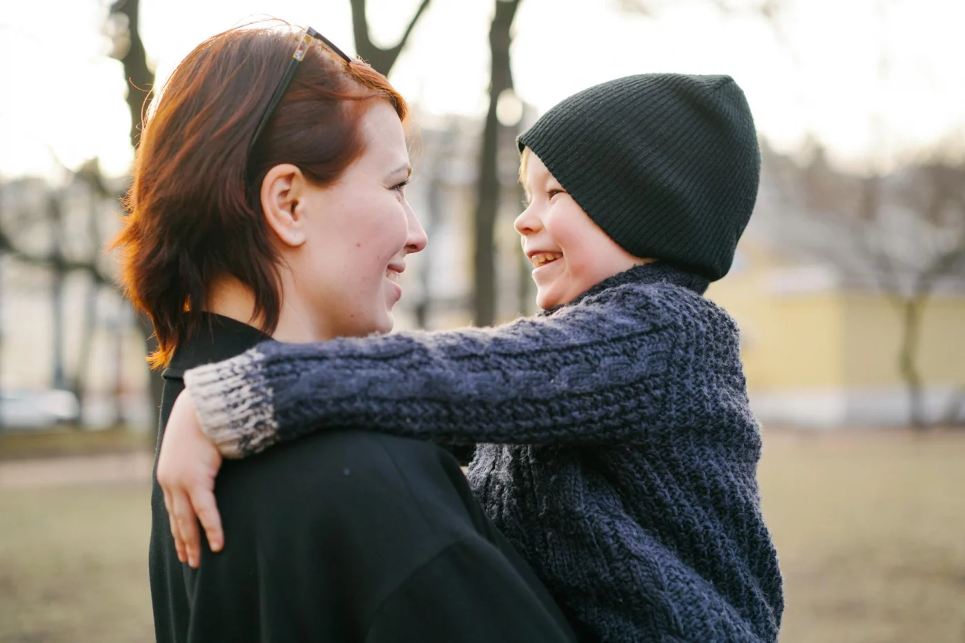 Mother and child sharing a warm moment in a park, illustrating why psychologists ask, does authoritative parenting work